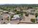 An aerial view of the property highlighting its proximity to nearby neighborhoods and the lush green trees at 12682 N 80Th Pl, Scottsdale, AZ 85260