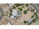 Aerial view of home featuring a pool, putting green, manicured landscaping and desert surroundings at 12682 N 80Th Pl, Scottsdale, AZ 85260