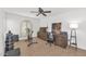 Versatile bedroom with fitness equipment, desk, and a ceiling fan at 12682 N 80Th Pl, Scottsdale, AZ 85260
