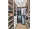 Well-organized walk-in closet with shelves, drawers, and hanging storage space at 12682 N 80Th Pl, Scottsdale, AZ 85260
