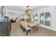 Open dining area features natural light, modern light fixture, with comfortable seating at 12682 N 80Th Pl, Scottsdale, AZ 85260