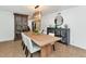 Bright dining room with modern light fixture, table, and white chairs at 12682 N 80Th Pl, Scottsdale, AZ 85260