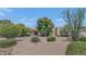 Charming single-story home with desert landscaping and mature trees creating a serene and inviting outdoor space at 12682 N 80Th Pl, Scottsdale, AZ 85260