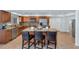 Kitchen featuring stainless steel appliances, granite countertops, and a spacious island with seating at 12682 N 80Th Pl, Scottsdale, AZ 85260