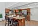 Kitchen with stainless steel appliances, a granite island, and bar stool seating at 12682 N 80Th Pl, Scottsdale, AZ 85260