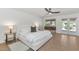 Bright main bedroom with stylish furniture, French doors, and ample natural light at 12682 N 80Th Pl, Scottsdale, AZ 85260