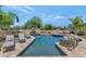 Inviting backyard pool area with ample lounge seating, lush landscaping, and a serene outdoor ambiance at 12682 N 80Th Pl, Scottsdale, AZ 85260