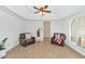 Cozy sitting room with comfortable chairs, ample natural light, and trey ceiling at 12682 N 80Th Pl, Scottsdale, AZ 85260