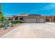 Well maintained single story home with a three car garage and desert landscaping at 13034 W Krall Ct, Glendale, AZ 85307