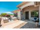 Inviting front entry with a seating area and colorful shrubbery creating a warm welcome at 13034 W Krall Ct, Glendale, AZ 85307