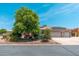 Charming desert home with a tile roof, solar panels and a meticulously xeriscaped front yard at 13034 W Krall Ct, Glendale, AZ 85307
