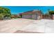 Spacious three-car garage and an expansive driveway provide ample parking at this home at 13034 W Krall Ct, Glendale, AZ 85307