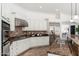 Modern kitchen equipped with granite countertops, stainless steel appliances, and ample cabinet space at 13034 W Krall Ct, Glendale, AZ 85307