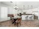 Open kitchen area with a dining table, breakfast bar, and plenty of cabinet space at 13034 W Krall Ct, Glendale, AZ 85307