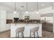 Open kitchen with an island, granite countertops, stainless steel appliances and pendant lighting at 13034 W Krall Ct, Glendale, AZ 85307