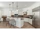 Well-appointed kitchen featuring white cabinetry, granite countertops, and stainless steel appliances at 13034 W Krall Ct, Glendale, AZ 85307