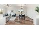 Open-concept living area with dining table and chairs; natural light and neutral tones at 13034 W Krall Ct, Glendale, AZ 85307