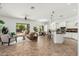 Spacious living room with tile flooring, a ceiling fan, and seamless flow to the kitchen at 13034 W Krall Ct, Glendale, AZ 85307