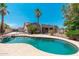 Sparkling pool with lush landscaping and a clear view of the home's backyard and exterior at 13034 W Krall Ct, Glendale, AZ 85307