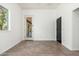 Bright, unfurnished room with tile flooring, a window, and neutral paint, ready for customization at 13034 W Krall Ct, Glendale, AZ 85307