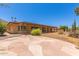 Charming backyard showcasing a covered patio, artistic stone pavers, and serene views, ideal for relaxation at 132 W Wood Dr, Phoenix, AZ 85029