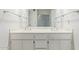 Bright bathroom featuring a double sink vanity with marble countertops and white cabinets at 132 W Wood Dr, Phoenix, AZ 85029