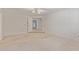 Bedroom features neutral carpet, white walls, ceiling fan with lighting, and bright natural light at 132 W Wood Dr, Phoenix, AZ 85029
