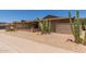 Charming single-story brick home featuring desert landscaping, a front patio, and an attached two-car garage at 132 W Wood Dr, Phoenix, AZ 85029