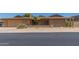 Charming single-story brick home featuring desert landscaping, a front patio, and an attached two-car garage at 132 W Wood Dr, Phoenix, AZ 85029