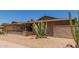 Charming single-story brick home featuring desert landscaping, a front patio, and an attached two-car garage at 132 W Wood Dr, Phoenix, AZ 85029