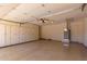 Spacious garage with built-in cabinets, offering ample storage and organization for vehicles and equipment at 132 W Wood Dr, Phoenix, AZ 85029