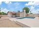 Backyard features a pool and patio area at 1417 W Los Arboles Pl, Chandler, AZ 85224