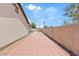 Backyard features a pool and brick patio at 1417 W Los Arboles Pl, Chandler, AZ 85224