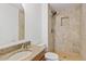 Bathroom featuring tiled walk-in shower and granite vanity at 1417 W Los Arboles Pl, Chandler, AZ 85224