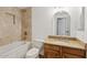 Bathroom featuring bathtub, framed mirror, and granite vanity at 1417 W Los Arboles Pl, Chandler, AZ 85224