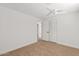 A bright bedroom with carpet, ceiling fan, and a closet at 1417 W Los Arboles Pl, Chandler, AZ 85224