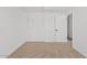 A bright bedroom with carpet and a closet at 1417 W Los Arboles Pl, Chandler, AZ 85224