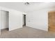 Spacious bedroom featuring carpet, walk-in closet, and attached bath at 1417 W Los Arboles Pl, Chandler, AZ 85224