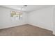 Bedroom featuring neutral carpet and large window at 1417 W Los Arboles Pl, Chandler, AZ 85224