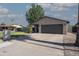 Charming single-story home featuring a spacious driveway and a well-maintained front yard at 1417 W Los Arboles Pl, Chandler, AZ 85224