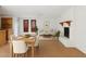 Open-concept living and dining area featuring stylish furniture and fireplace at 1417 W Los Arboles Pl, Chandler, AZ 85224
