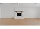 Bright living room with a cozy white-brick fireplace and tile flooring at 1417 W Los Arboles Pl, Chandler, AZ 85224