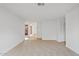 Spacious empty living room with neutral carpet, ready for customization at 1417 W Los Arboles Pl, Chandler, AZ 85224