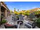 Cozy backyard with a fire pit and comfortable seating surrounding the pool at 14518 N 99Th St, Scottsdale, AZ 85260