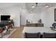 Entertaining space featuring a bar with marble countertops and a wine fridge near the seating area at 14518 N 99Th St, Scottsdale, AZ 85260