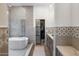Bathroom featuring free-standing tub, glass shower, and marble countertops at 14518 N 99Th St, Scottsdale, AZ 85260