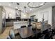 Gourmet kitchen featuring a large island, modern appliances, and stylish lighting fixtures at 14518 N 99Th St, Scottsdale, AZ 85260