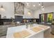 Modern kitchen island with white countertop and stainless steel appliances at 14518 N 99Th St, Scottsdale, AZ 85260