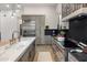 Spacious kitchen featuring stainless steel appliances, kitchen island and wood flooring at 14518 N 99Th St, Scottsdale, AZ 85260