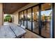 Covered patio with large sliding glass doors leading into the living room at 14518 N 99Th St, Scottsdale, AZ 85260